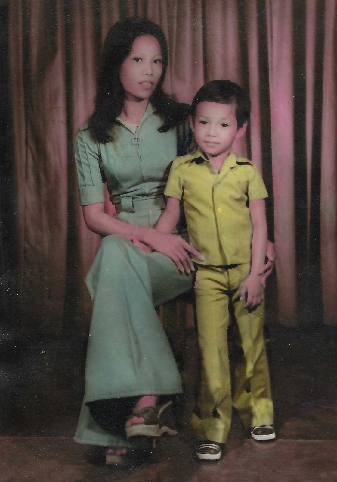 A small child with their mother, evoking Jimmy Ezzell's humble beginnings in St. Joseph, Missouri
